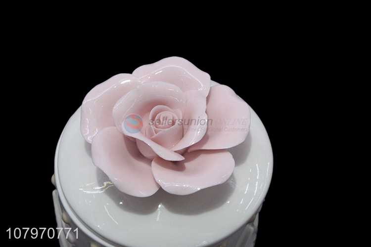 China factory embossed ceramic jewelry storage box with flower lid