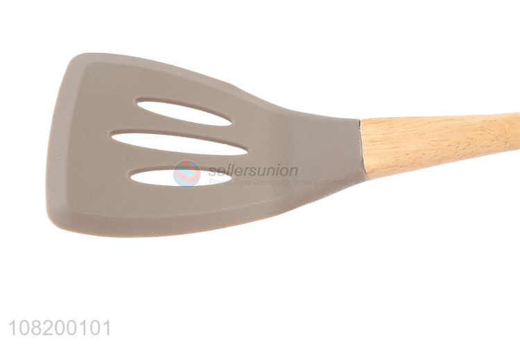 Yiwu market wooden handle slotted spatula for cooking