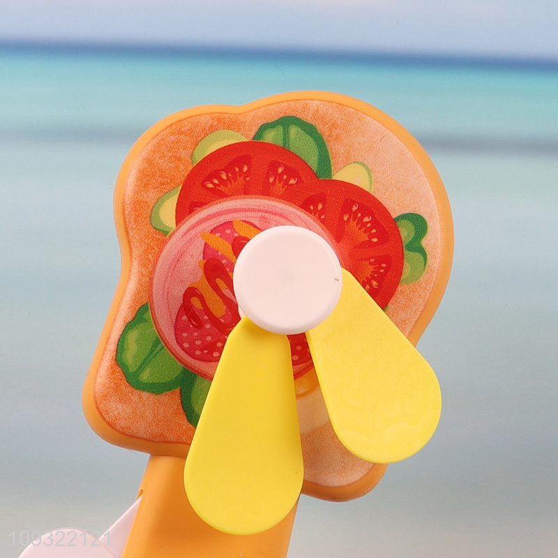 Top selling cartoon handheld press fan for summer